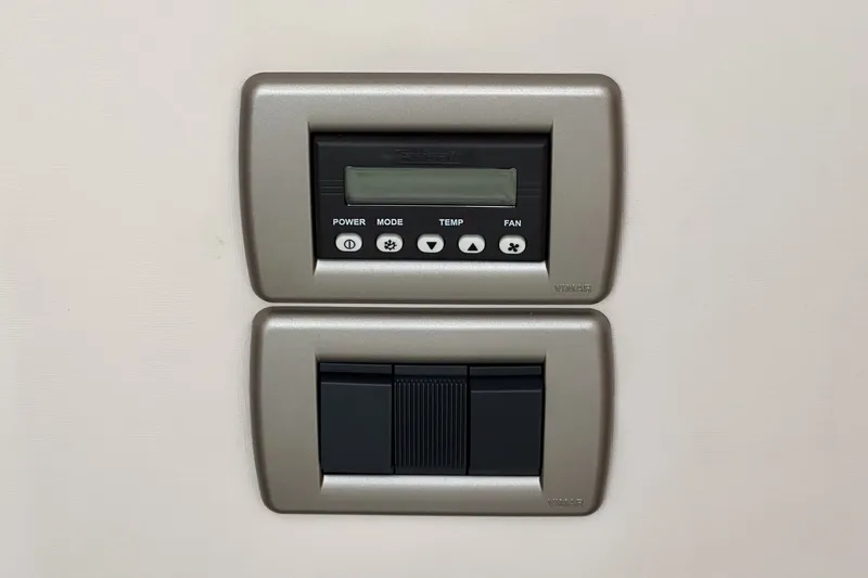 Slide: The Image of Control panel and switches on a 2017 Sea Ray Sundancer 400 yacht. - 45