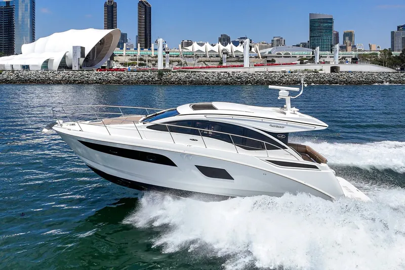 Slide: The Image of 2017 Sea Ray Sundancer 400 cruising near modern waterfront architecture. - 54