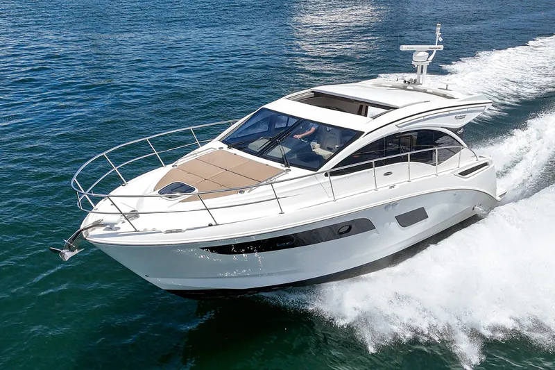 Slide: The Image of 2017 Sea Ray Sundancer 400 cruising on open water, showcasing sleek design and luxury features. - 56