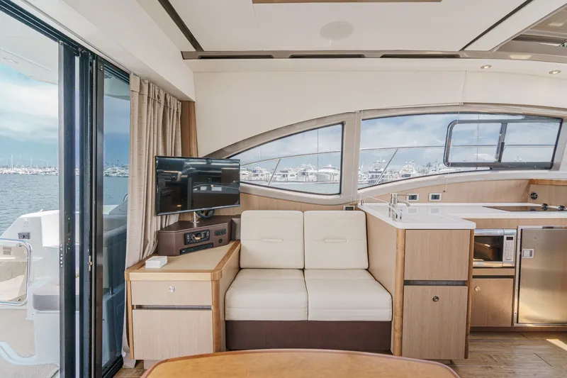 Slide: The Image of Luxurious interior of 2017 Sea Ray Sundancer 400 yacht with modern amenities and scenic marina view. - 15