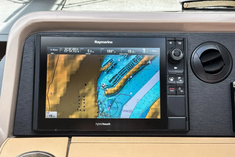 Slide: The Image of Raymarine navigation display on 2017 Sea Ray Sundancer 400, showing nautical chart and coordinates. - 25