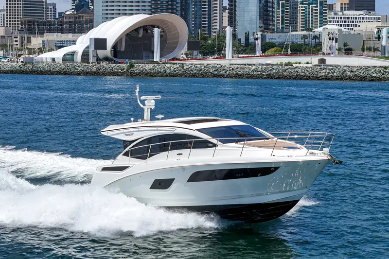 Slide: The Image of 2017 Sea Ray Sundancer 400 cruising in urban waterfront setting. - 59