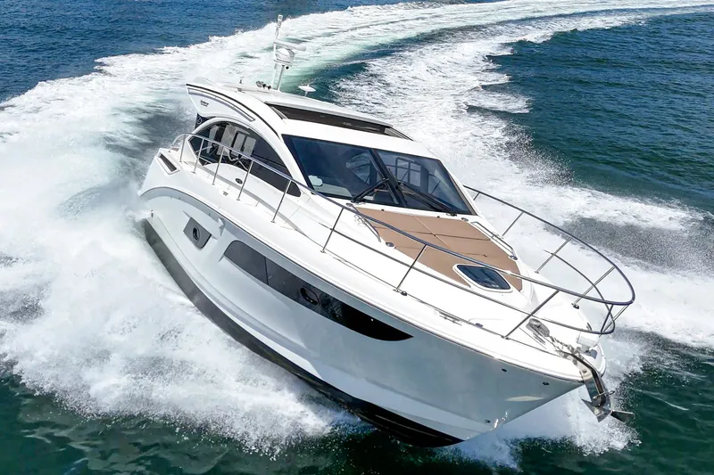 Slide: The Image of 2017 Sea Ray Sundancer 400 cruising on open water, showcasing sleek design and powerful performance. - 57
