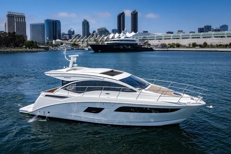 Slide: The Image of 2017 Sea Ray Sundancer 400 yacht cruising near city skyline. - 67