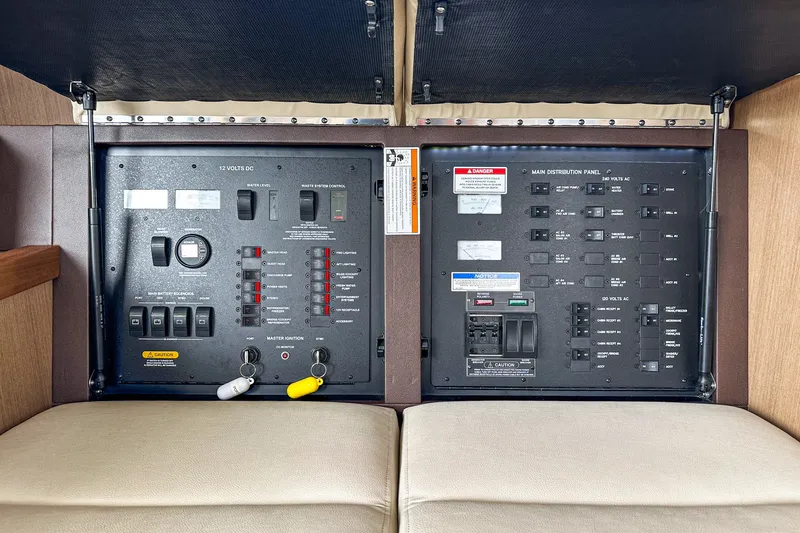 Slide: The Image of Electrical control panel on a 2017 Sea Ray Sundancer 400 yacht, featuring switches and gauges. - 43