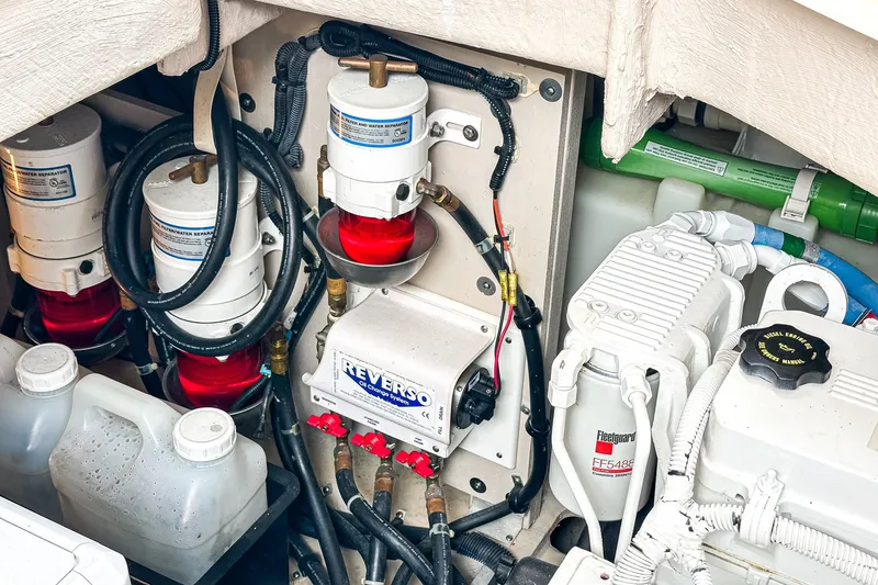 Slide: The Image of Engine compartment of 2017 Sea Ray Sundancer 400 with fuel filters and Reverso oil change system. - 41