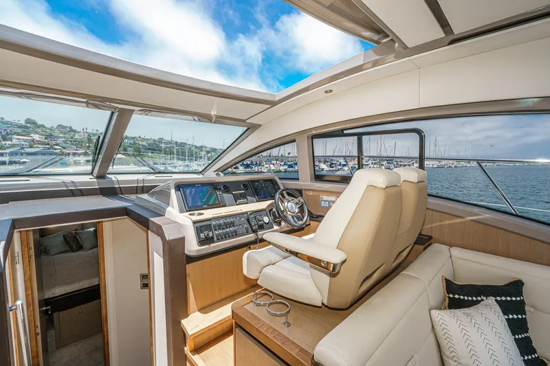 Slide: The Image of Interior of 2017 Sea Ray Sundancer 400 yacht with luxurious helm and panoramic views. - 22