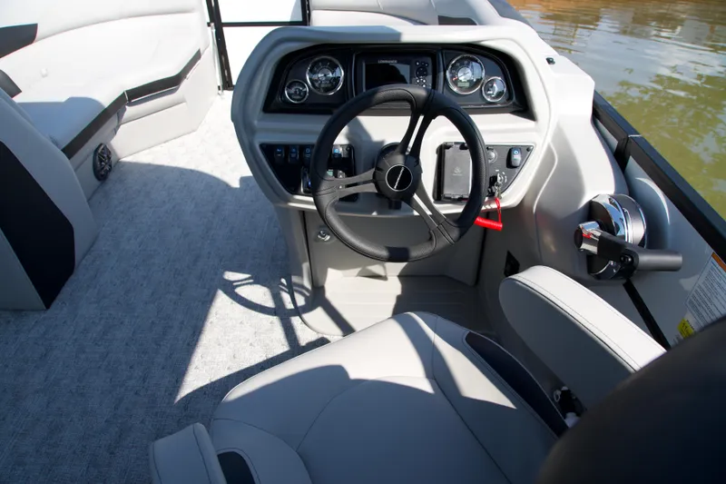 Slide: The Image of Interior view of 2026 Berkshire 22 RFX LE boat cockpit with steering wheel and controls. - 11