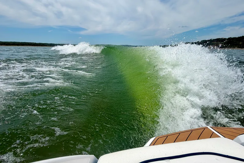 Slide: The Image of Wake created by 2022 Nautique Super Air Nautique GS24 on a sunny day. - 12