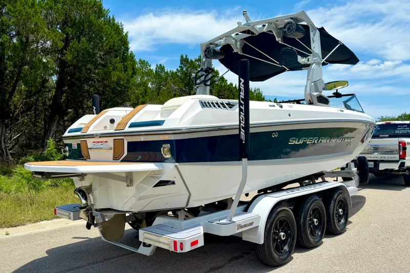 Slide: The Image of 2022 Nautique Super Air Nautique GS24 boat on trailer, parked outdoors. - 16