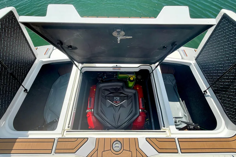 Slide: The Image of 2022 Nautique Super Air Nautique GS24 engine compartment with PCM engine, open hatch view. - 29