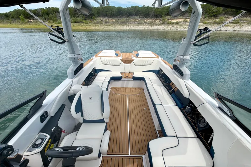 Slide: The Image of 2022 Nautique Super Air Nautique GS24 boat interior with luxurious seating and sleek design. - 33