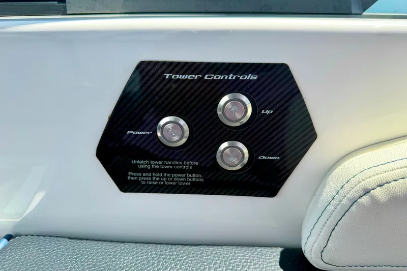Slide: The Image of 2022 Nautique Super Air Nautique GS24 tower controls with power, up, and down buttons. - 46