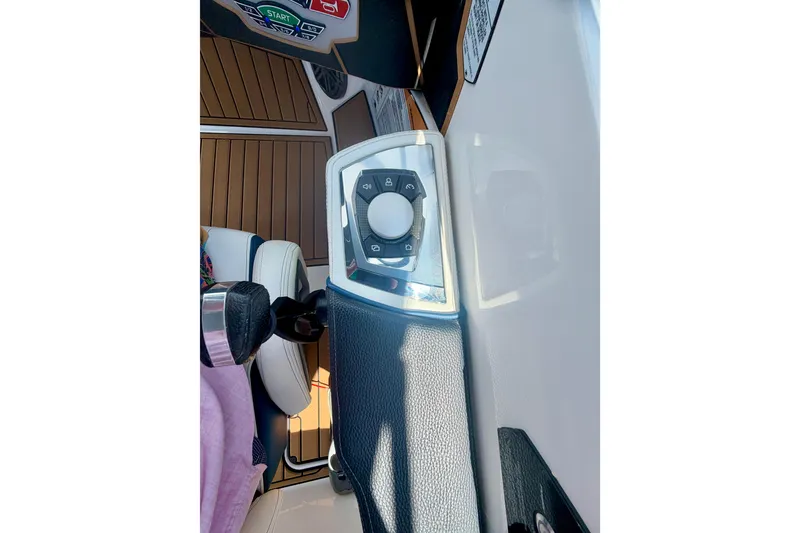 Slide: The Image of 2022 Nautique Super Air Nautique GS24 dashboard with control panel and steering wheel. - 47