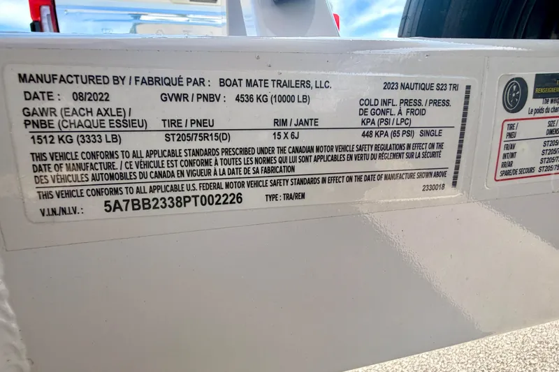 Slide: The Image of Label on 2022 Nautique Super Air Nautique GS24 trailer, detailing specifications and compliance information. - 49