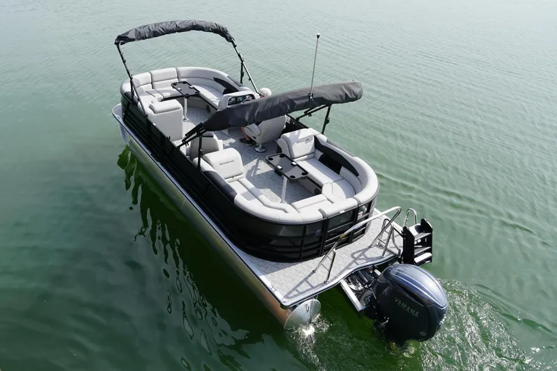 Slide: The Image of Berkshire 24 RFX LE 2026 pontoon boat on calm water. - 3