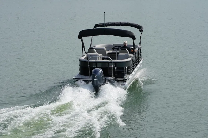 Slide: The Image of Berkshire 24 RFX LE 2026 pontoon boat on calm water. - 5