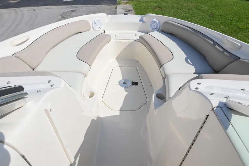 Slide: The Image of Interior view of a 2002 Sea Ray 240 Sundeck boat with cushioned seating. - 13