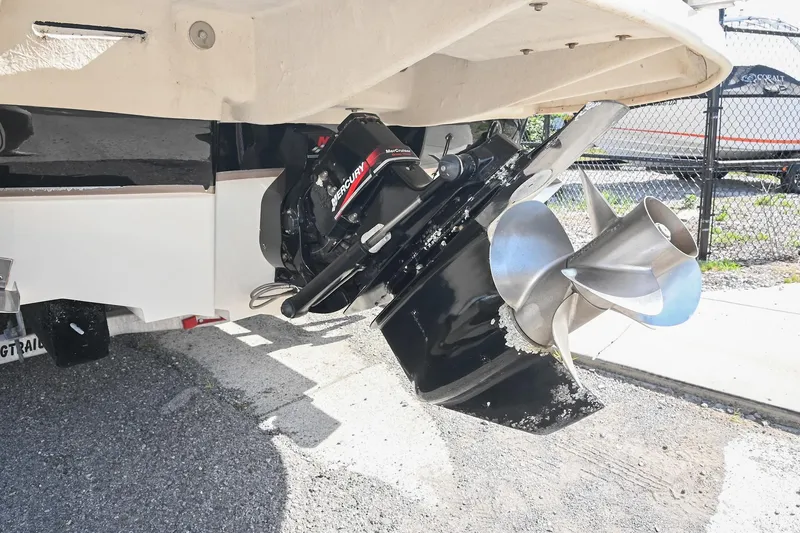 Slide: The Image of Close-up of a 2002 Sea Ray 240 Sundeck boat propeller and outdrive. - 16
