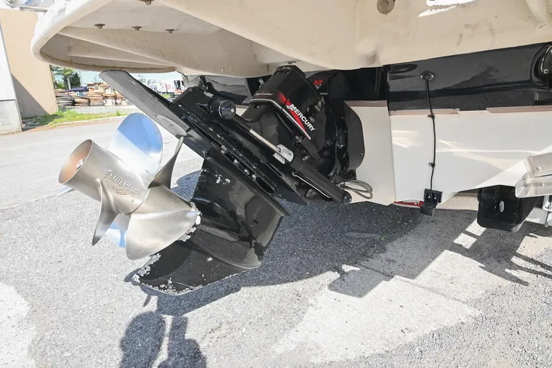 Slide: The Image of 2002 Sea Ray 240 Sundeck boat with Mercury outboard motor and stainless steel propeller. - 30