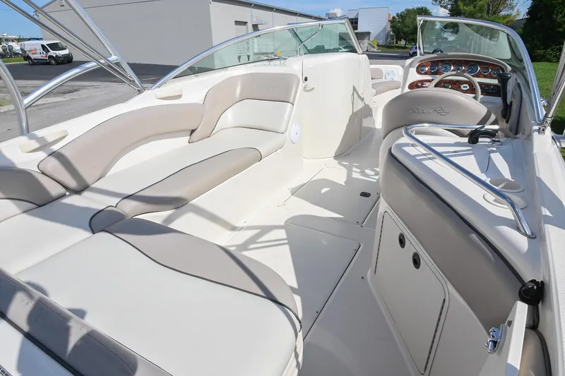 Slide: The Image of Interior view of a 2002 Sea Ray 240 Sundeck boat, featuring spacious seating and sleek design. - 9