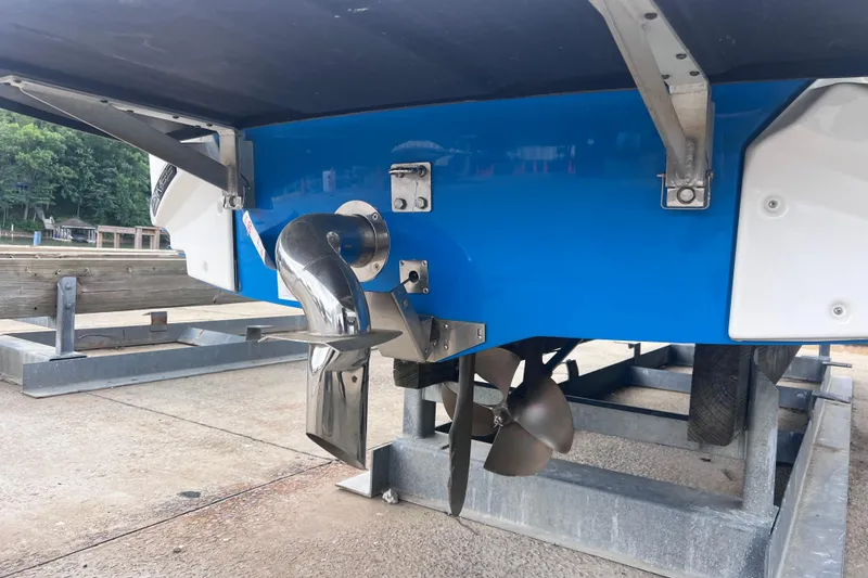 Slide: The Image of 2016 Nautique Super Air Nautique 210 boat propeller and exhaust system on trailer. - 17
