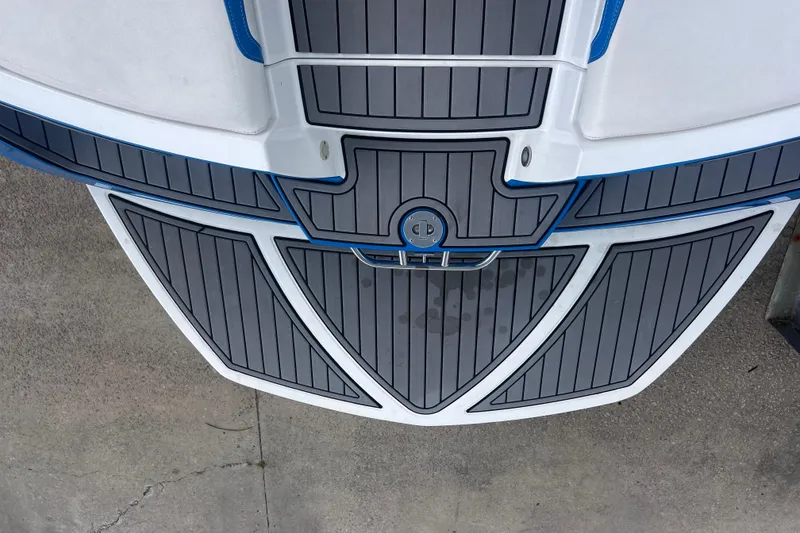 Slide: The Image of 2016 Nautique Super Air Nautique 210 swim platform with gray and blue detailing. - 18