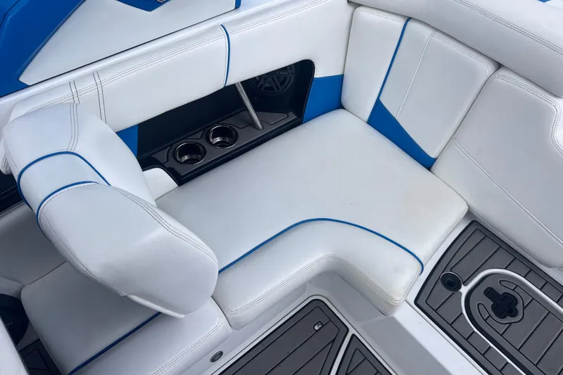 Slide: The Image of Interior of 2016 Nautique Super Air Nautique 210 with white seating. - 23