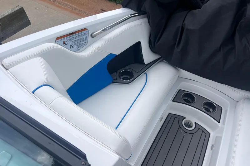 Slide: The Image of Interior of 2016 Nautique Super Air Nautique 210 boat with white and blue seating. - 29