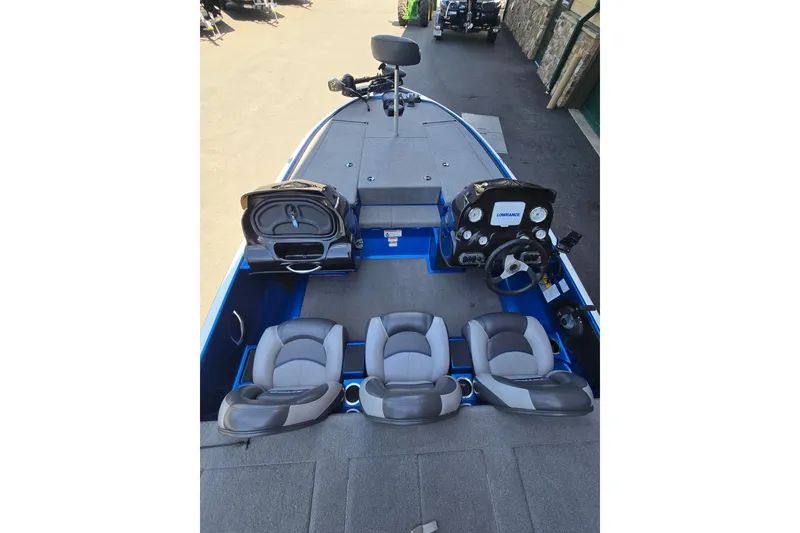 Slide: The Image of 2014 Nitro Z-7 boat interior with seating, steering console, and storage compartments. - 4