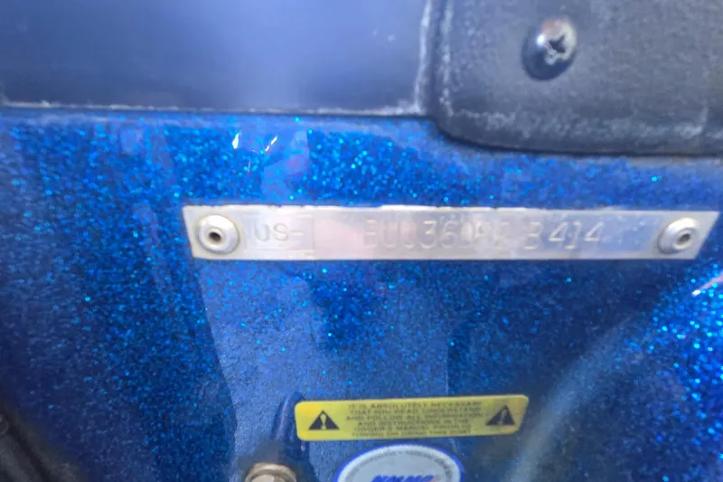 Slide: The Image of 2014 Nitro Z-7 boat with blue glitter finish and identification plate. - 5