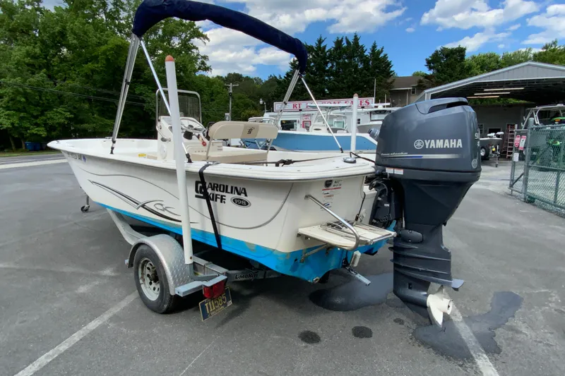 Slide: The Image of 2016 Carolina Skiff 198 DLV boat with Yamaha outboard motor on trailer. - 12