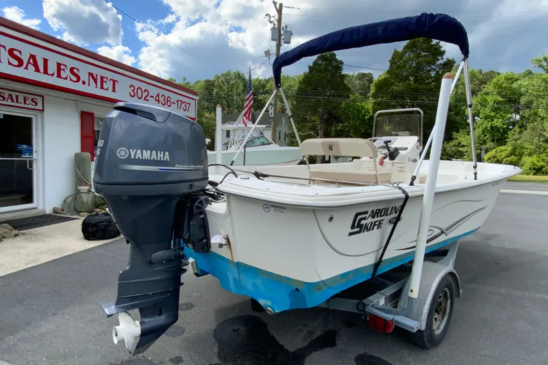 Slide: The Image of 2016 Carolina Skiff 198 DLV boat with Yamaha outboard motor on trailer. - 14