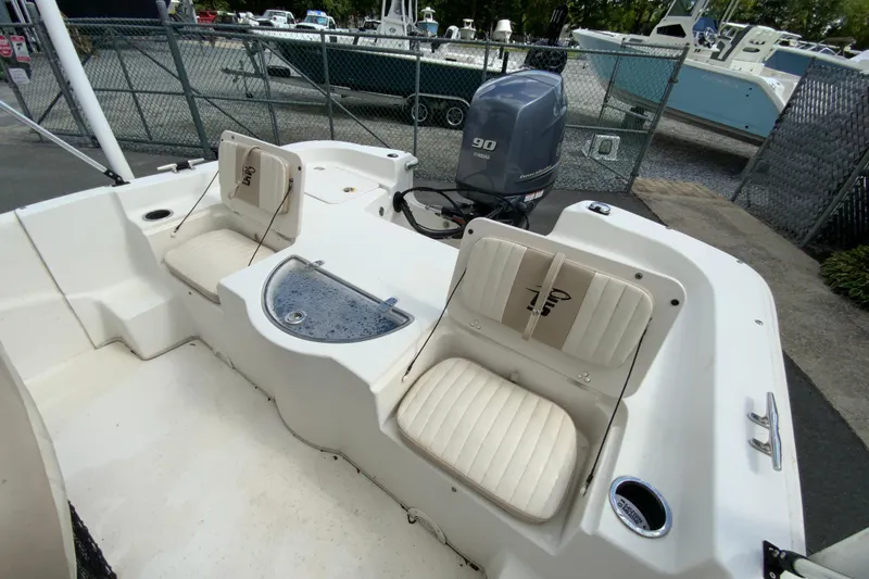 Slide: The Image of 2016 Carolina Skiff 198 DLV boat interior with seating and Yamaha outboard motor. - 20