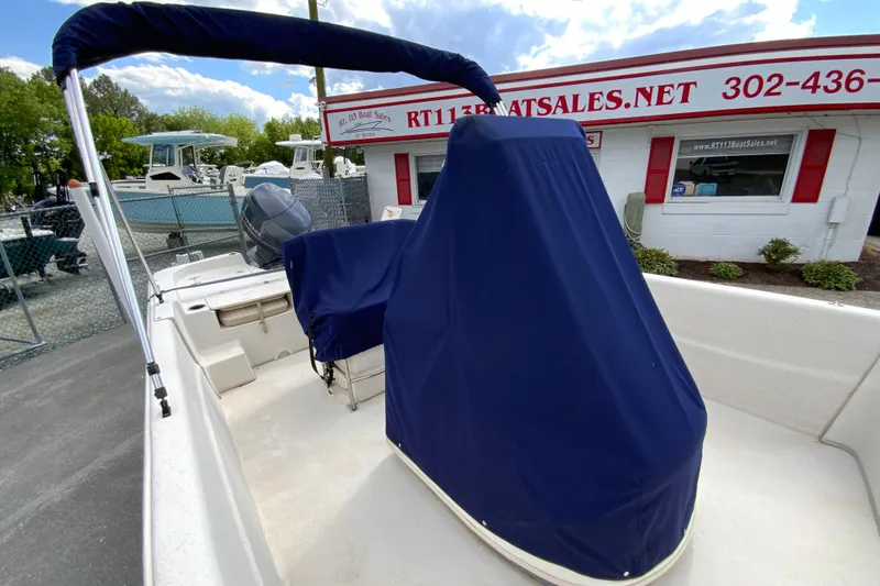Slide: The Image of 2016 Carolina Skiff 198 DLV boat with blue cover at dealership. - 4
