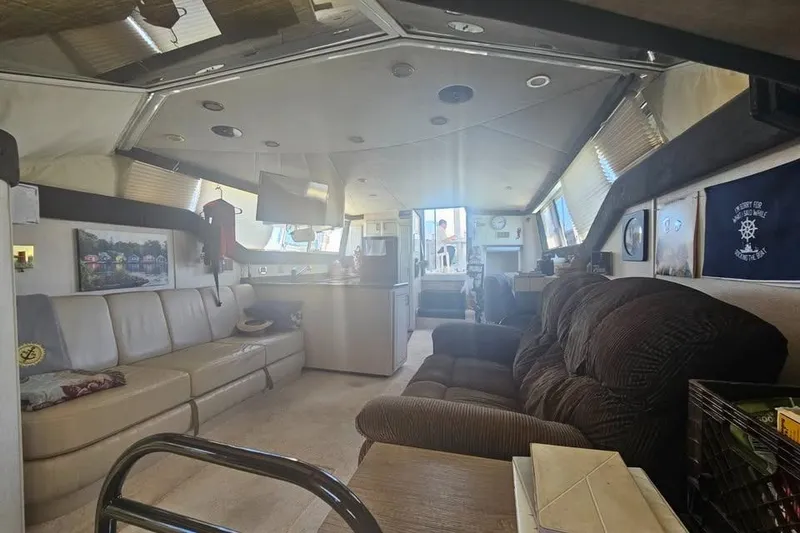 Slide: The Image of Interior of a 1998 Mainship 47 Motor Yacht with comfortable seating and modern amenities. - 27