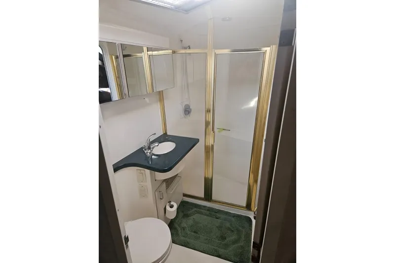 Slide: The Image of Bathroom interior of 1998 Mainship 47 Motor Yacht with shower and sink. - 30