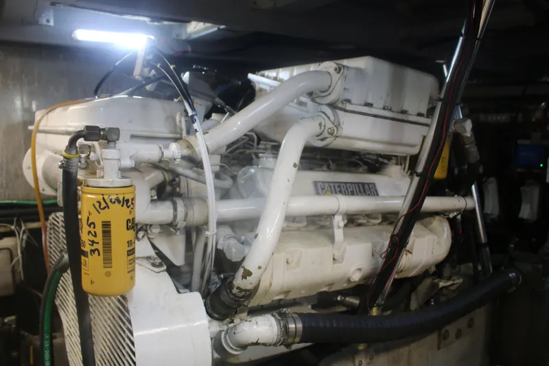 Slide: The Image of Engine room of a 1998 Mainship 47 Motor Yacht with Caterpillar engine. - 45
