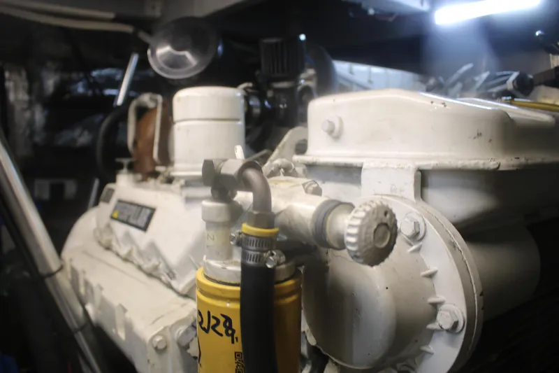 Slide: The Image of Engine room of a 1998 Mainship 47 Motor Yacht, showcasing mechanical components. - 47