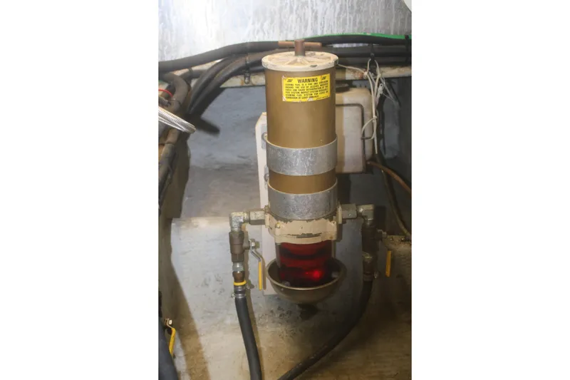 Slide: The Image of Fuel filter system in 1998 Mainship 47 Motor Yacht engine compartment. - 49