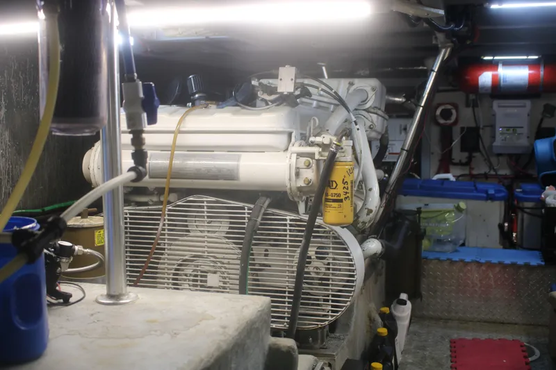 Slide: The Image of Engine room of a 1998 Mainship 47 Motor Yacht, showcasing machinery and equipment. - 50