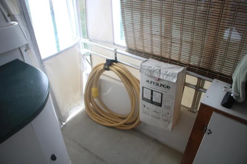 Slide: The Image of Interior of 1998 Mainship 47 Motor Yacht with lifesling and hose. - 65
