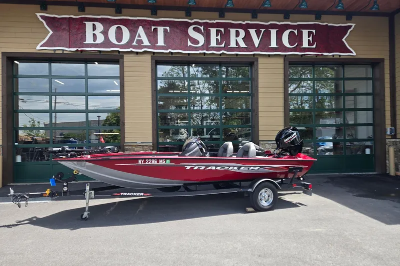 The Image of 2021 Tracker Pro Team 175 TXW boat parked outside a boat service center. - 0