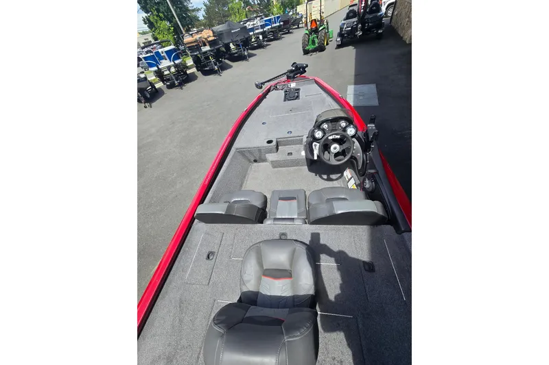Slide: The Image of 2021 Tracker Pro Team 175 TXW boat interior with steering wheel and seating. - 3