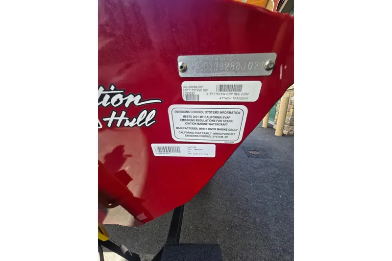 Slide: The Image of 2021 Tracker Pro Team 175 TXW boat hull identification and emission control labels. - 48