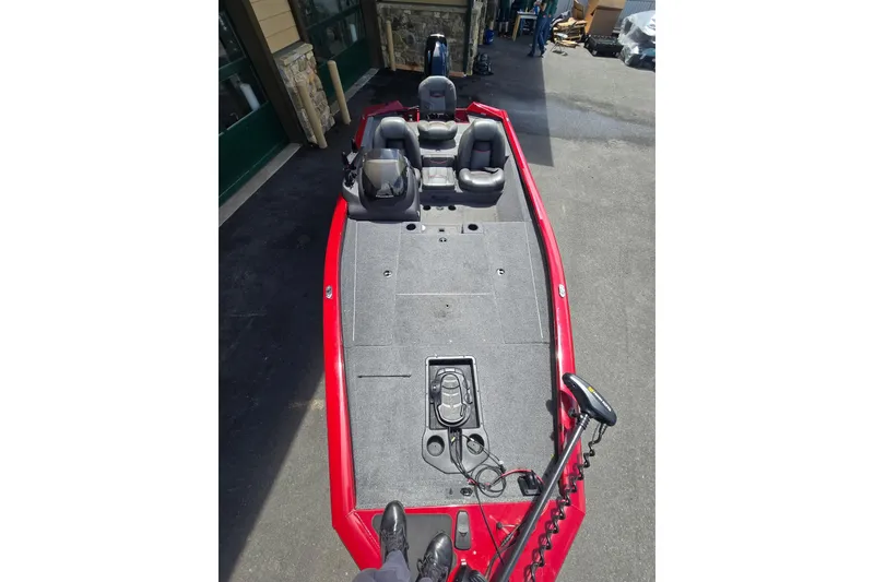 Slide: The Image of 2021 Tracker Pro Team 175 TXW boat with red exterior and spacious deck layout. - 5