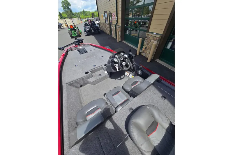 Slide: The Image of 2021 Tracker Pro Team 175 TXW boat interior with steering wheel and seating. - 6