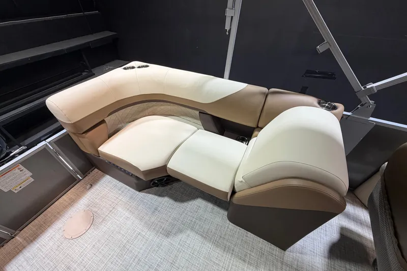 Slide: The Image of Luxurious seating on 2024 Lowe SS 230 boat, featuring beige and brown upholstery. - 11