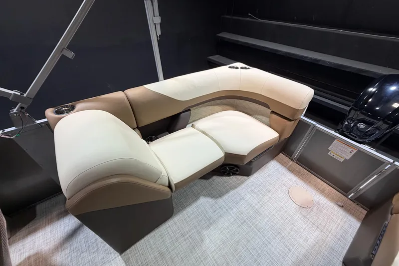 Slide: The Image of Luxurious seating on 2024 Lowe SS 230 boat, featuring beige and brown upholstery. - 12