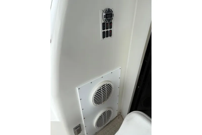 Slide: The Image of 2004 Carver 560 Voyager interior with control panel and speaker system. - 22